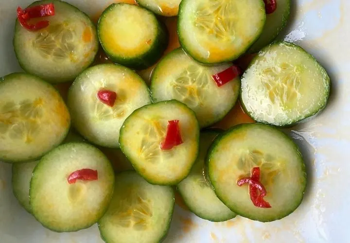 Din Tai Fung style cucumber salad, sliced rounds in a garlic dressing with red chilli through it