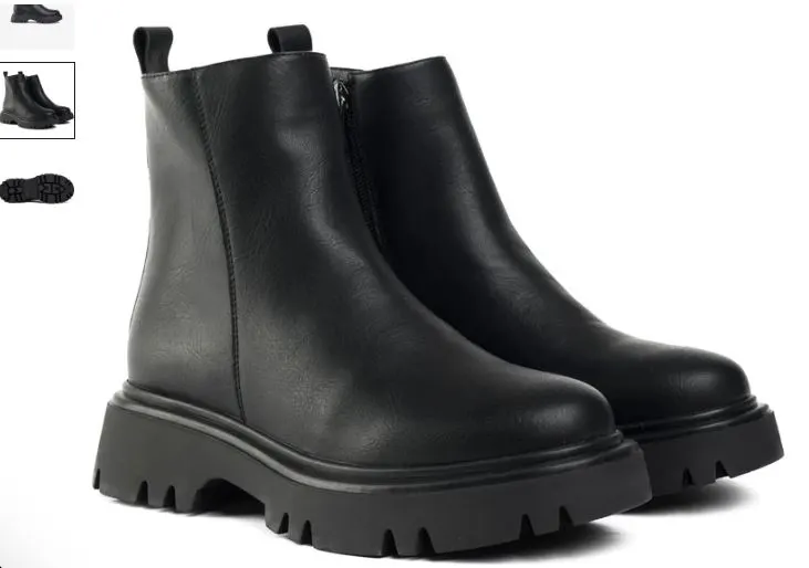 A pair of black leather ankle boots featuring a zipper, labeled as Cameo Vegan Ankle Boots by V.GAN. 